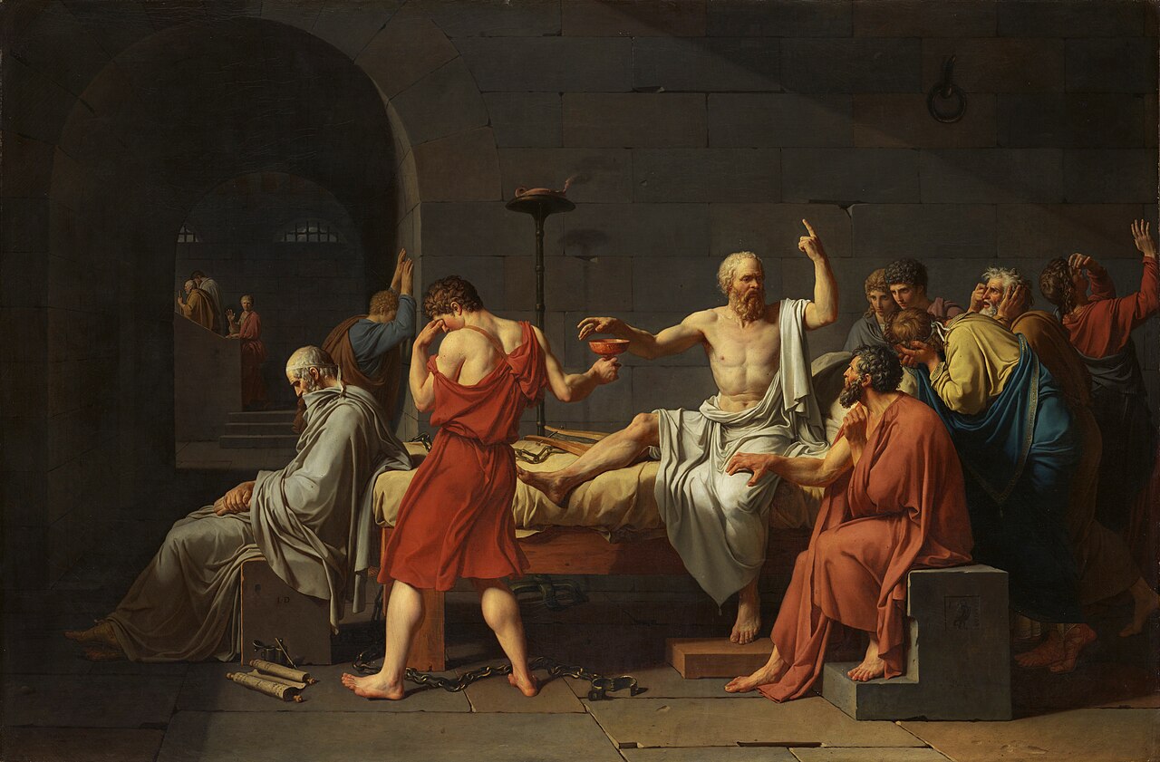 Jacques-Louis David, The Death of Socrates (1787) — the Met. David paints him mid-sentence, reaching for the cup without looking at it, one finger raised to heaven: still teaching. Plato — who in fact was absent, “sick” that day — sits aged and slumped at the foot of the bed, transcribing for eternity.